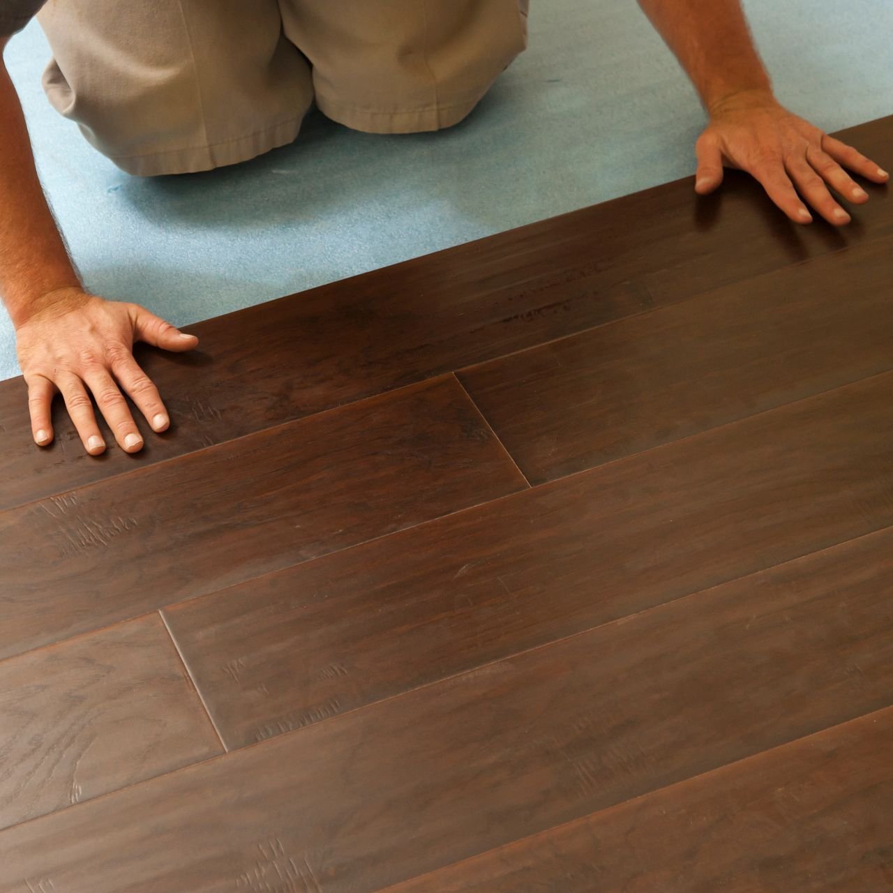 person installing flooring - Solano Carpet in CA